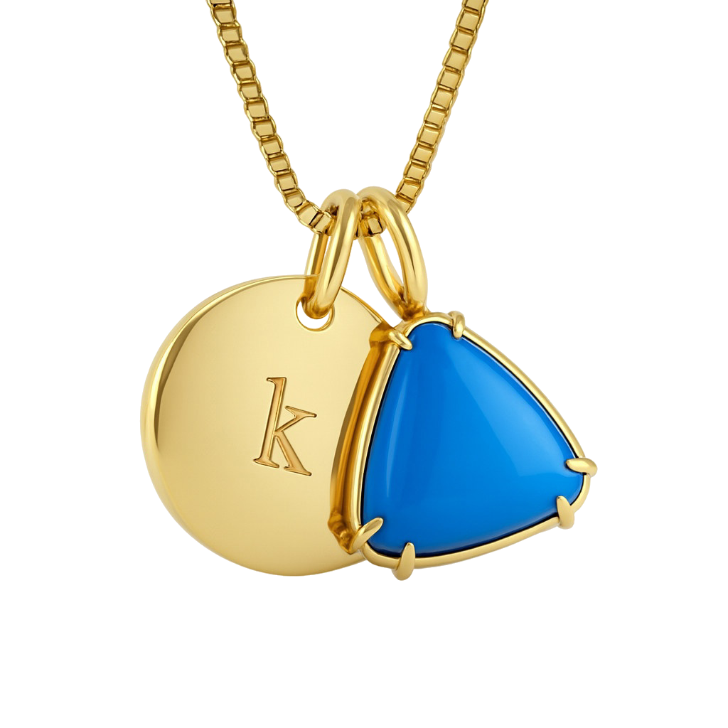 Gold pendant with blue gemstone